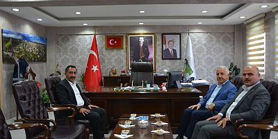 65. Hükümet UDH Bakanı Arslan'dan Genel Sekreter Tekcan'a ziyaret