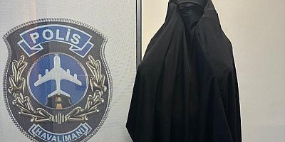 Kadın kılığındaki çarşaflı suçlu havaalanı polisinden kaçamadı